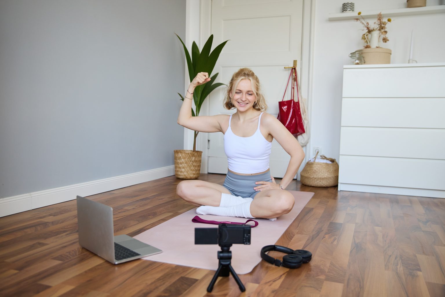 portrait young female athlete fitness trainer recording vlog training session digital camera scaled